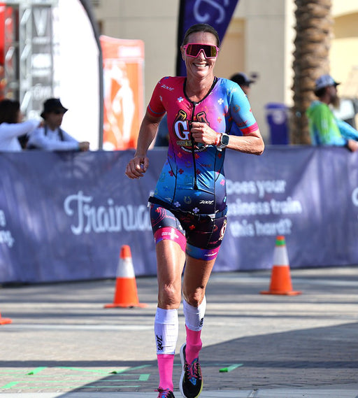 Athlete racing in Zoot custom racesuit