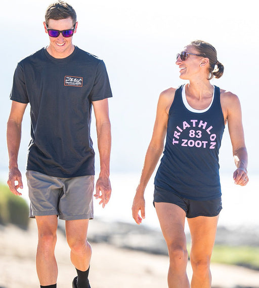 male and female walking together wearing zoot lifestyle tee and tank